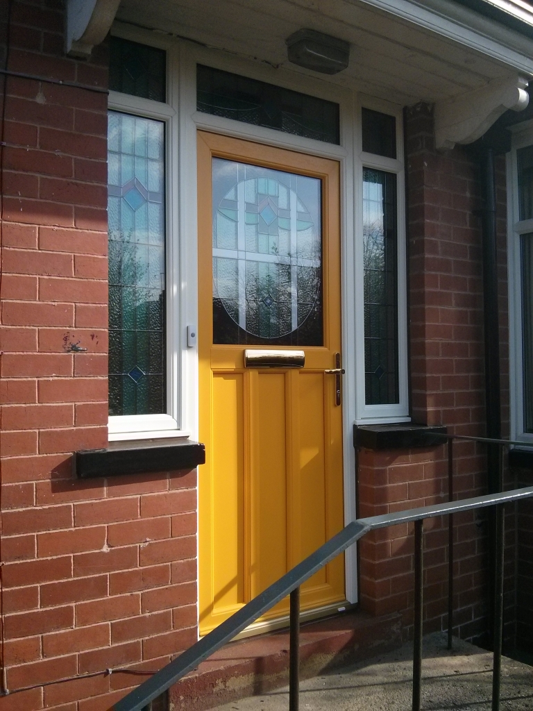 This is a different view. It took nearly 3 months to get this design to replicate the look of their old door and side lights as close as possible. We event copied the existing glass designs from the door, top lights and side lights into new triple glazed units. I think we did a pretty good job!