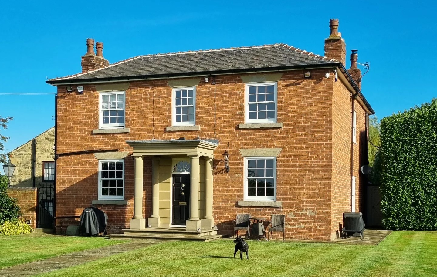 White wood grain PVCu sash windows